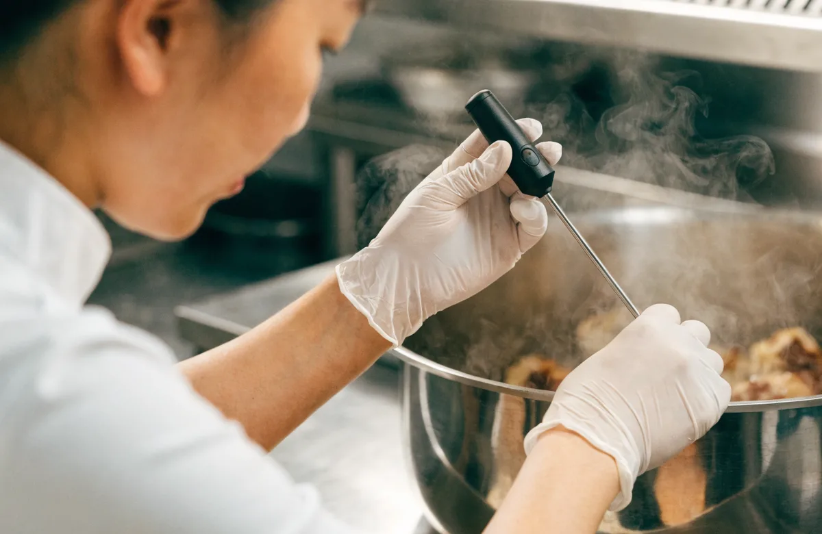 Food temperature control with a probe thermometer in a kitchen