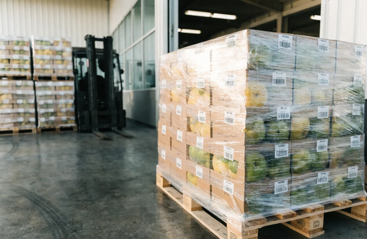 Labeled pallets of fruit ready for export shipment